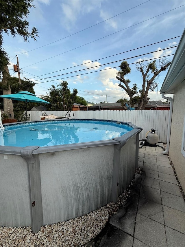 view of swimming pool featuring a fenced backyard and a fenced in pool