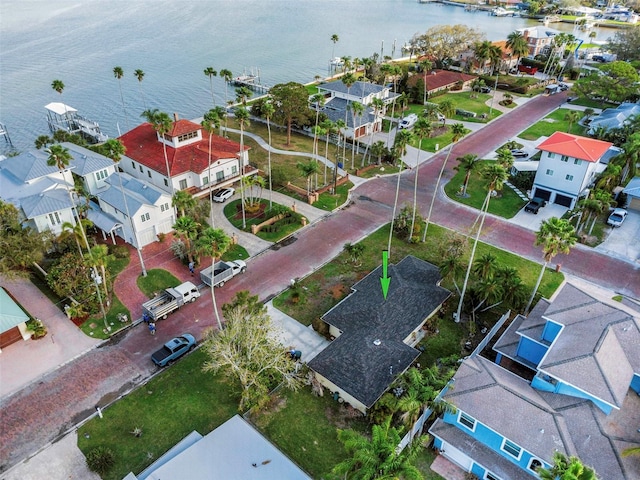 bird's eye view with a residential view and a water view