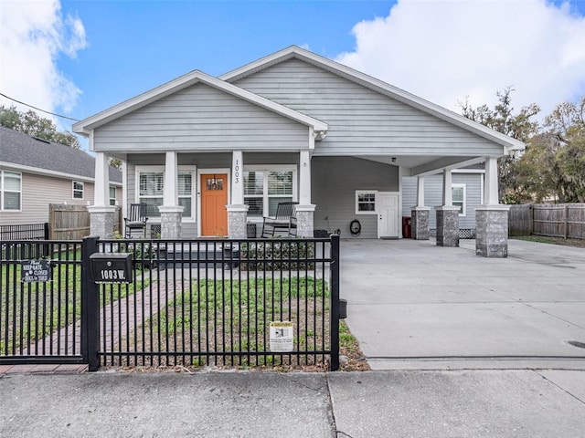 craftsman house featuring covered porch and a front yard