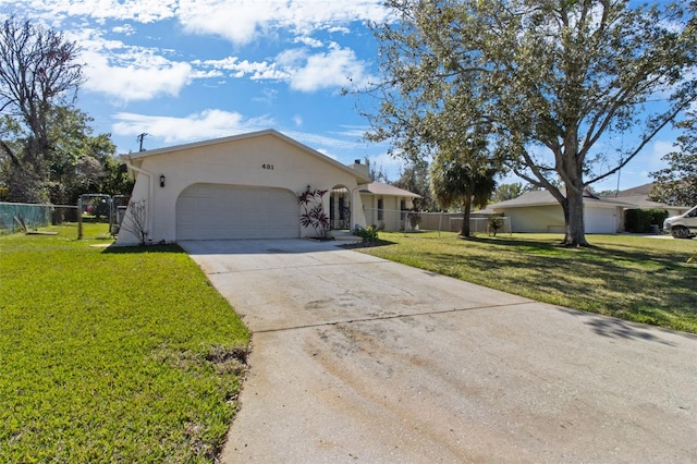 ranch-style home featuring a front lawn and a garage