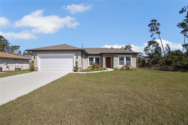 view of front of home featuring driveway, a garage, fence, a front yard, and stucco siding