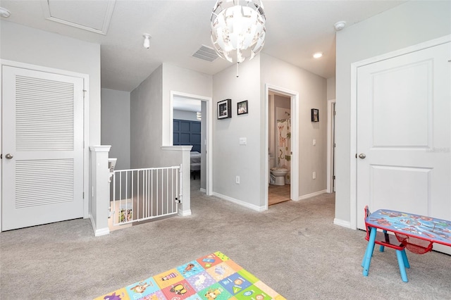 game room with baseboards, visible vents, and light colored carpet