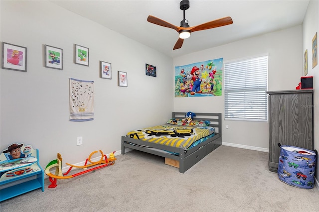 bedroom featuring ceiling fan, carpet flooring, and baseboards