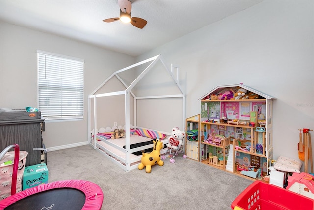 game room with light carpet, ceiling fan, and baseboards