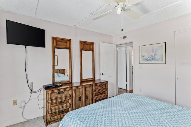 bedroom featuring visible vents and ceiling fan