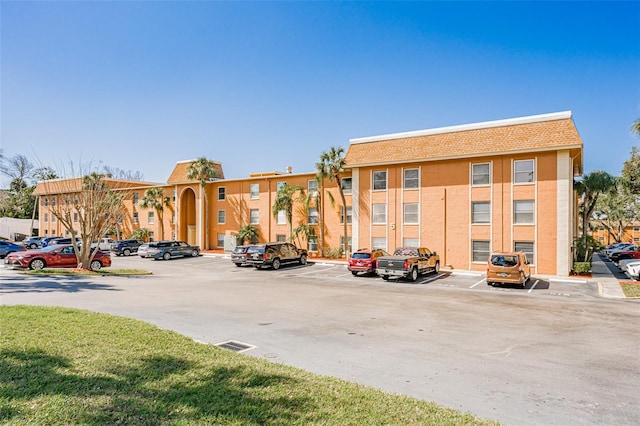 view of property with uncovered parking