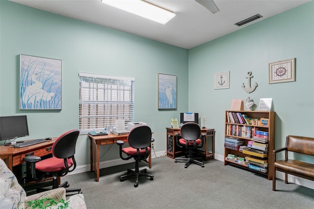 office area with carpet floors, visible vents, and baseboards