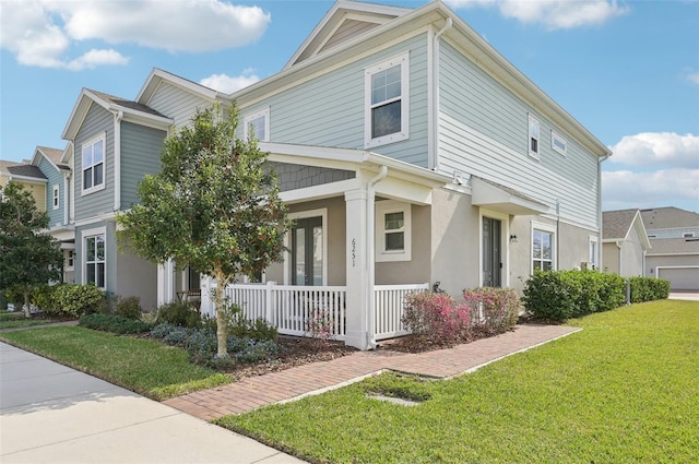 view of property exterior with a yard and covered porch