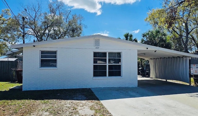 view of side of home featuring a carport