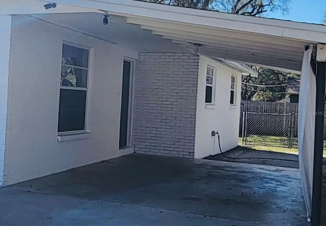 view of home's exterior featuring a carport