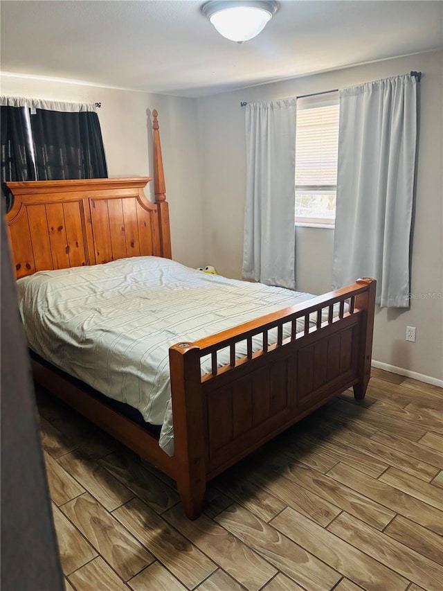 bedroom with wood-type flooring