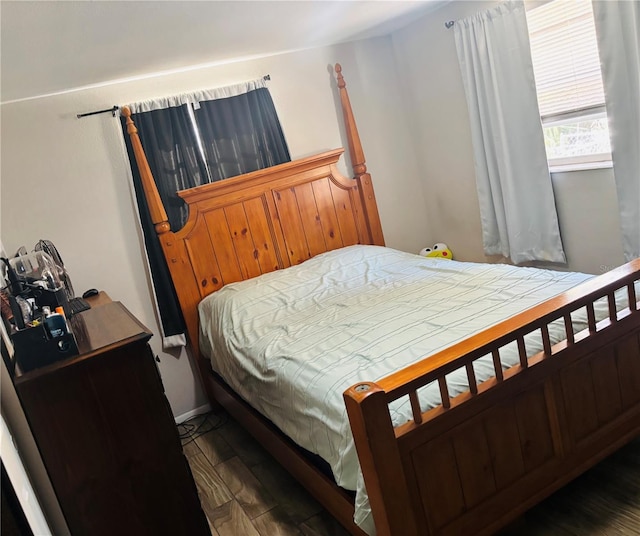 bedroom featuring dark hardwood / wood-style flooring