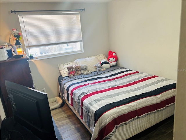 bedroom featuring dark wood-type flooring