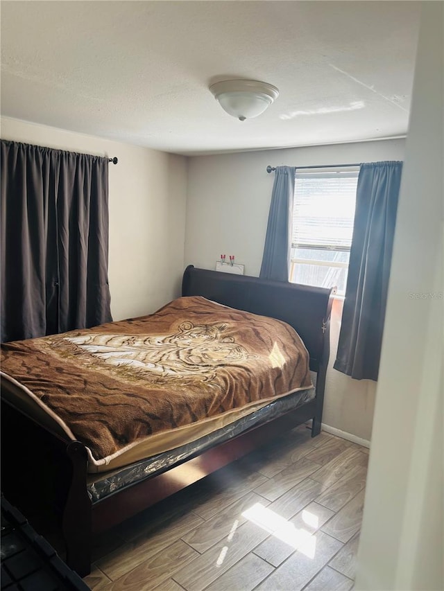 bedroom with wood-type flooring