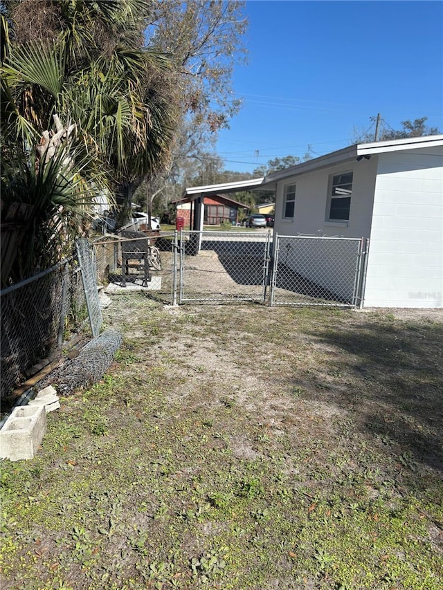 view of yard with a carport