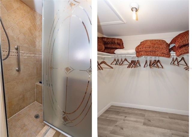 bathroom featuring a tile shower and wood finished floors