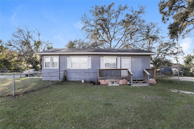 view of front of house with a front lawn and a deck