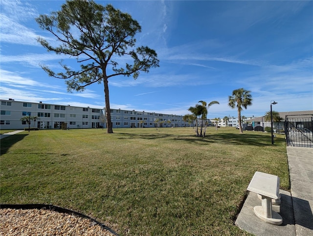 view of property's community with a lawn