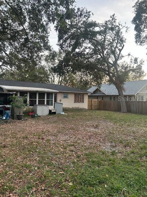 back of property with fence