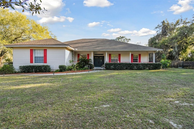 ranch-style home featuring a porch and a front yard