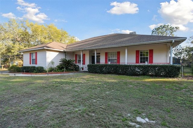 single story home with covered porch, a chimney, fence, and a front lawn