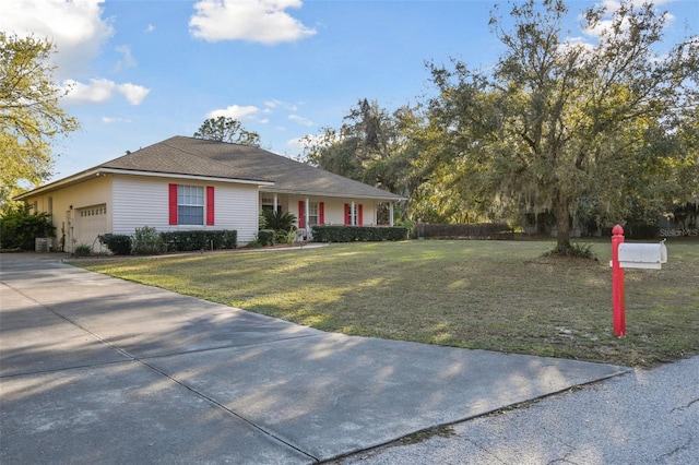 single story home with a garage, concrete driveway, and a front lawn