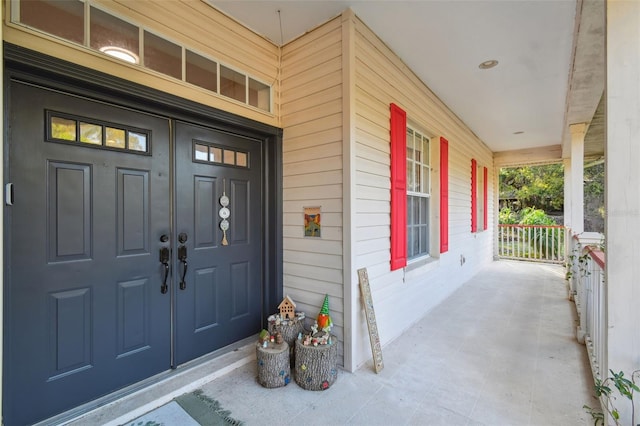 doorway to property featuring covered porch