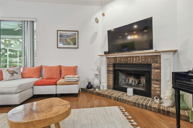 living room featuring a fireplace and wood finished floors