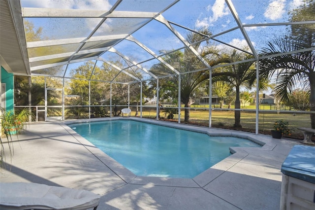 pool with a patio and a lanai