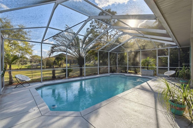 pool featuring a lanai and a patio