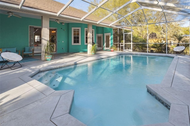 pool featuring a lanai, a ceiling fan, and a patio