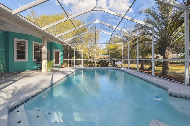 pool with a patio and a lanai