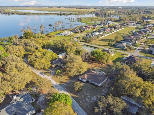 birds eye view of property featuring a water view and a residential view