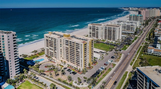 drone / aerial view featuring a water view and a beach view