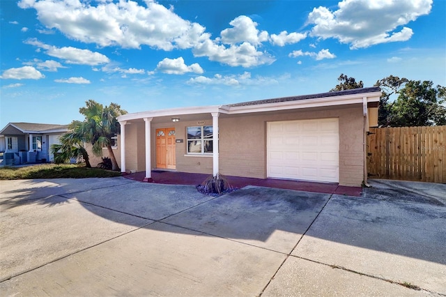 ranch-style home featuring a garage