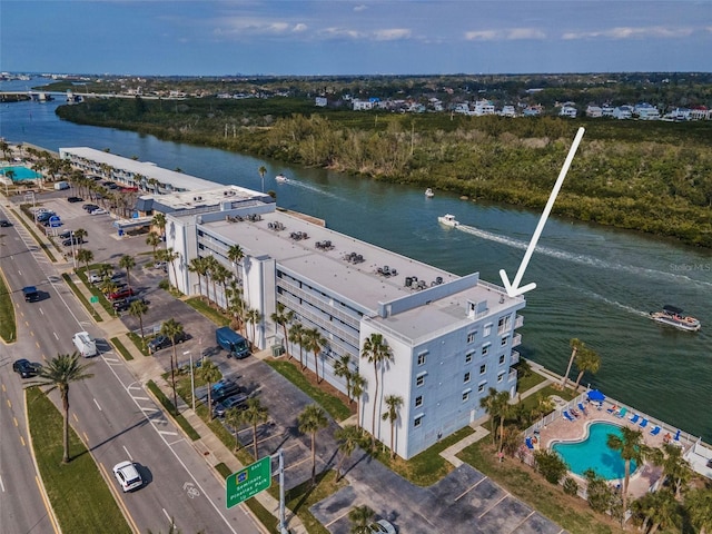 birds eye view of property with a water view