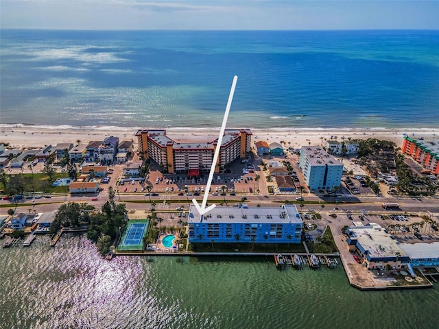 aerial view with a water view and a view of the beach