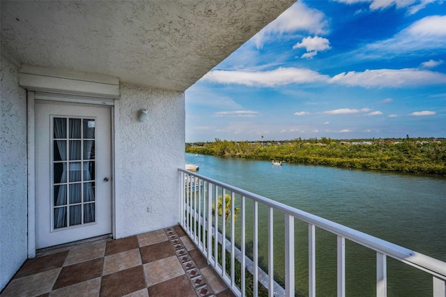 balcony featuring a water view