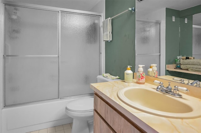 full bathroom featuring tile patterned floors, toilet, combined bath / shower with glass door, and vanity