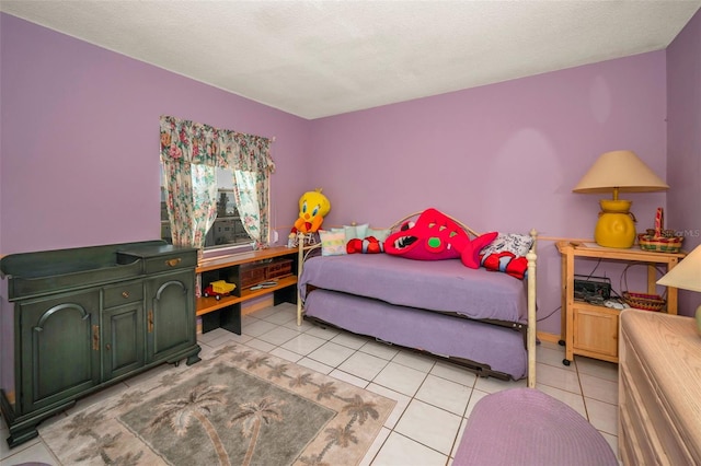 tiled bedroom with a textured ceiling