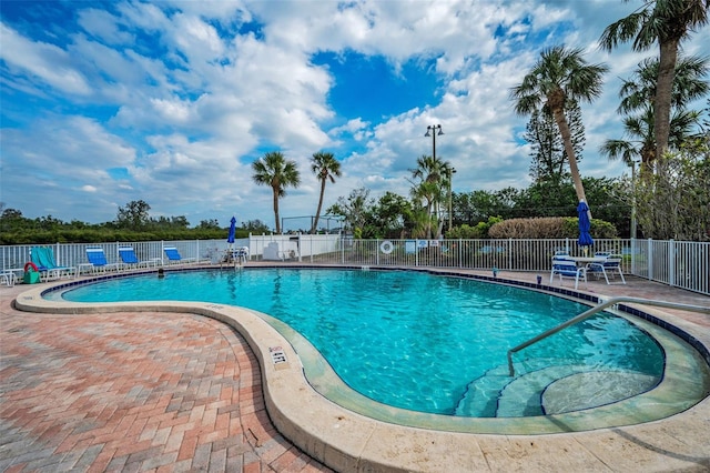 view of swimming pool featuring a patio