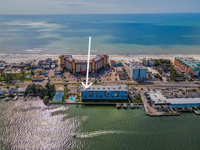 aerial view with a water view and a beach view