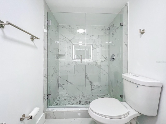 full bathroom featuring toilet and a shower stall