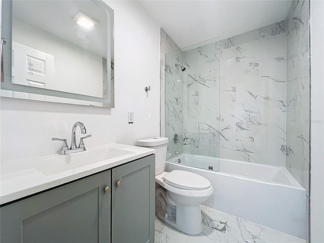 bathroom featuring marble finish floor, shower / tub combination, vanity, and toilet