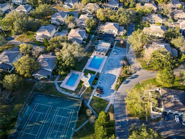 birds eye view of property with a residential view