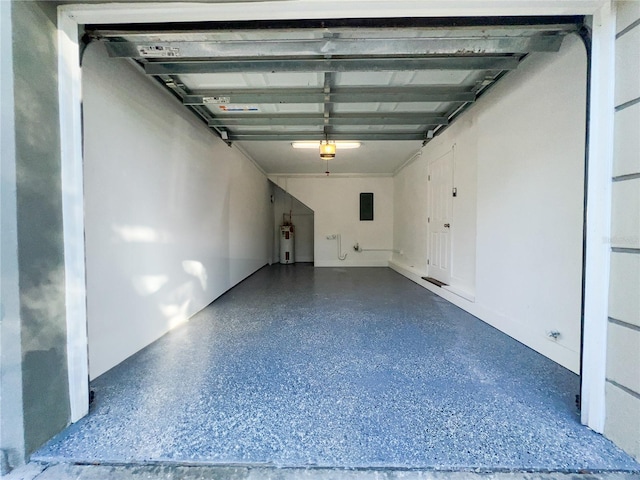 garage with water heater and electric panel