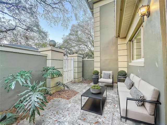 view of patio / terrace with fence and an outdoor living space