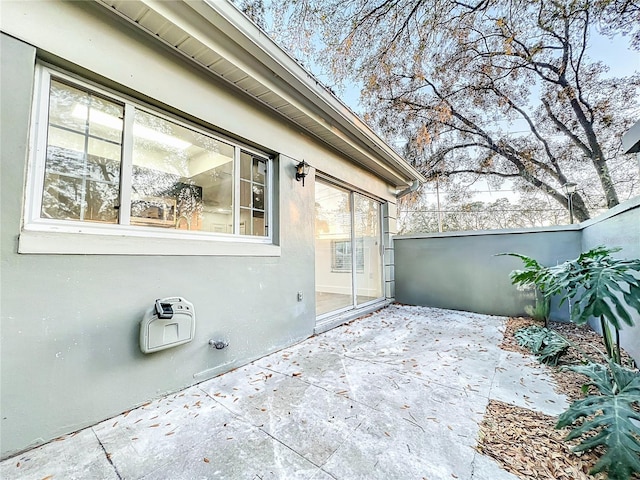 view of patio featuring fence