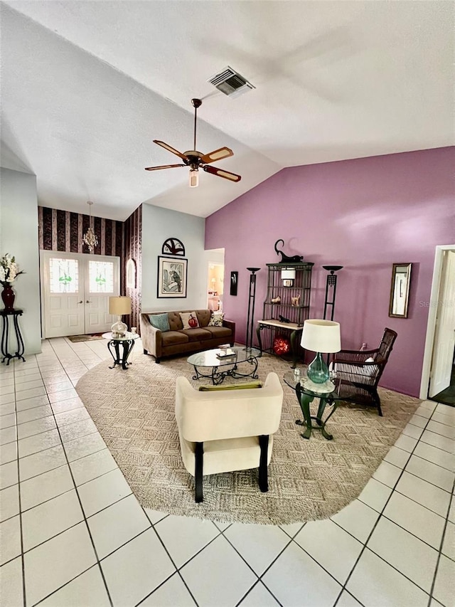 living room featuring light tile patterned flooring, vaulted ceiling, ceiling fan, and french doors