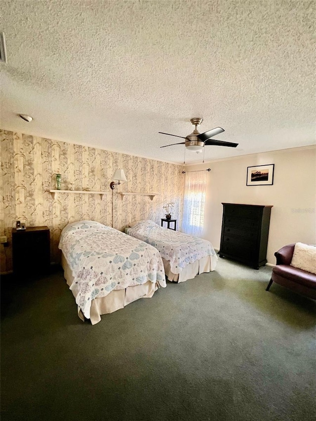 unfurnished bedroom with ceiling fan, carpet flooring, and a textured ceiling